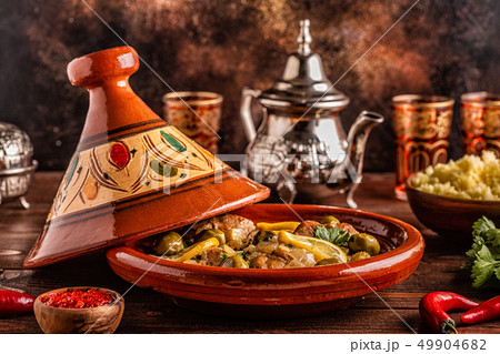 Traditional Moroccan chicken tagine with olives Traditional Moroccan chicken tagine with olives 49904682