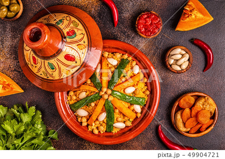 Vegetable tagine with almond and chickpea couscous Vegetable tagine with almond and chickpea couscous 49904721