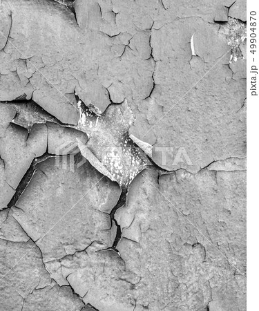 Old cracked paint on the concrete wall. Peeling Old cracked paint on the concrete wall. Peeling 49904870