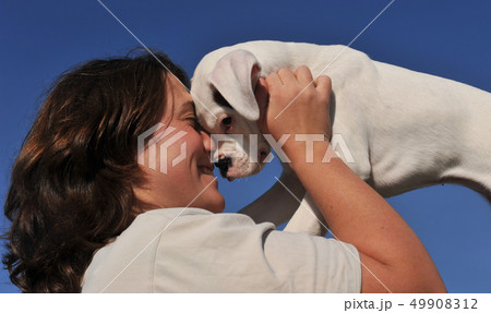 young woman and puppy 49908312