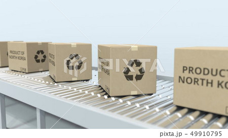 Cartons with PRODUCT OF NORTH KOREA text on roller conveyor. Korean import or export related 3D Cartons with PRODUCT OF NORTH KOREA text on roller conveyor. Korean import or export related 3D 49910795