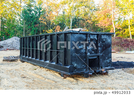 Dumpsters being full with garbage 49912033