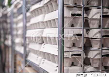 Boxes with chicken eggs on the supermarket shelf. Boxes with chicken eggs on the supermarket shelf. 49912261