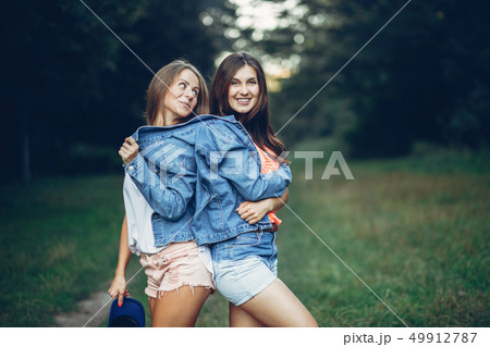 Two pretty girls in a summer park 49912787