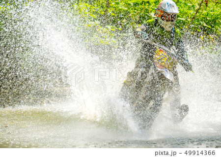 Sport Bike Driver and Water Spray 49914366