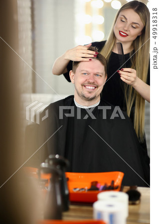 An attractive man came to hairdresser An attractive man came to hairdresser 49918318