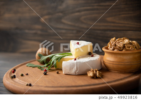 Cheese camembert or brie with walnuts and arugula Cheese camembert or brie with walnuts and arugula 49923816