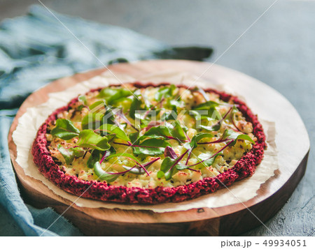 beetroot pizza crust with fresh mangold leaves 49934051