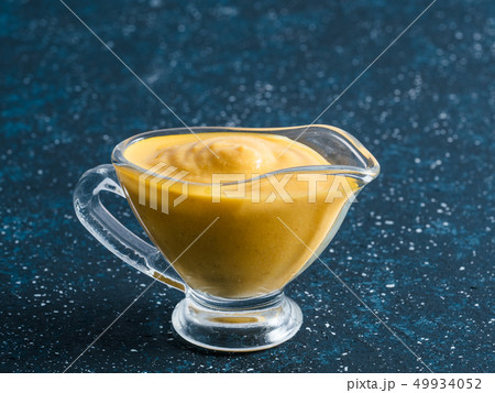 Vegan creamy cheddar cheese sauce with chia seeds Vegan creamy cheddar cheese sauce with chia seeds 49934052