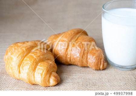 Croissants and milk on table.  Food for breakfast 49937998