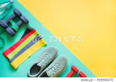 Fitness equipment, dumbbells, rubber band. 49940870