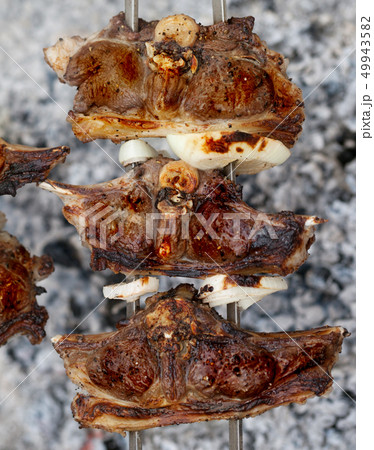 Kebab of lamb cooking in outdoor Kebab of lamb cooking in outdoor 49943582