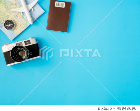 top view travel concept with retro camera films. top view travel concept with retro camera films. 49943696