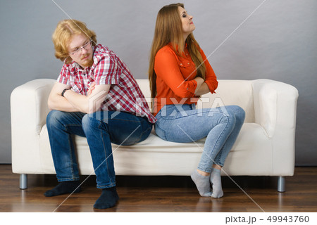 Woman and man after argue on sofa Woman and man after argue on sofa 49943760