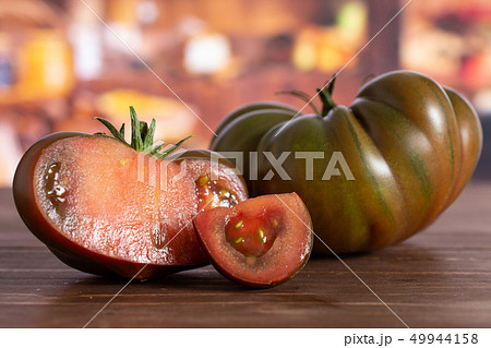 Fresh dark tomato primora with rustic kitchen 49944158