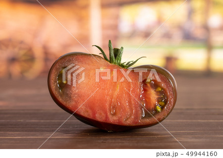 Fresh dark tomato primora with cart Fresh dark tomato primora with cart 49944160