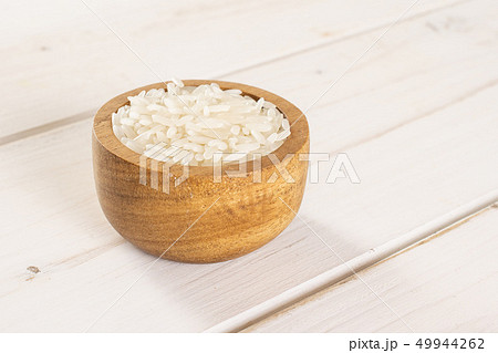 White jasmine rice on grey wood White jasmine rice on grey wood 49944262