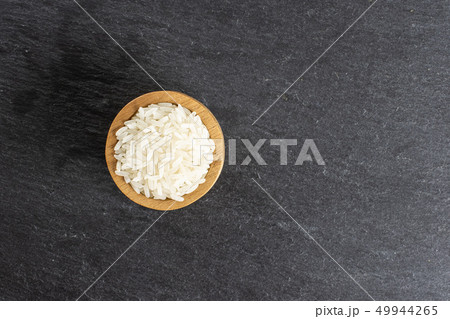 White jasmine rice on grey stone White jasmine rice on grey stone 49944265