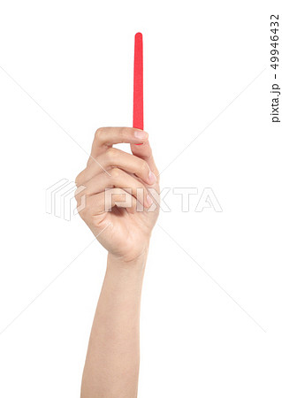 Vertical view of a woman holding a nail file Vertical view of a woman holding a nail file 49946432