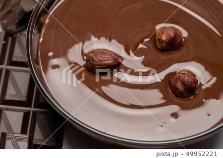 glass bowl of chocolate cream or melted chocolate isolated on white 49952221