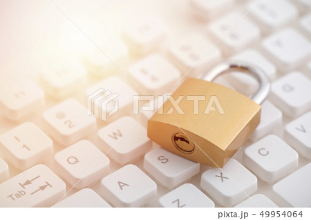 Security concept with metal padlock on keyboard Security concept with metal padlock on keyboard 49954064