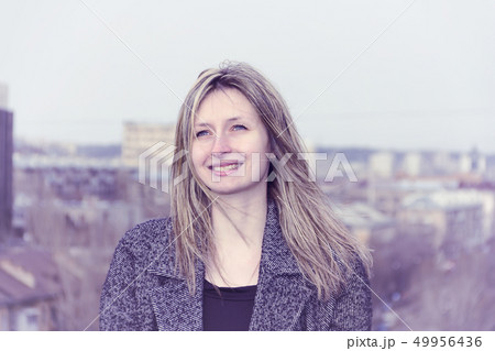 Portrait of a girl on the roof of the building. 49956436