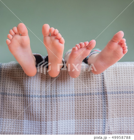 BareFeet of Kids. Toes and heels of two boys. Body 49958788