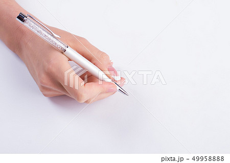 Beautiful female hand with manicure hold a pen. Beautiful female hand with manicure hold a pen. 49958888