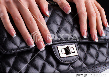 Beautiful french manicure with leather bag. Beautiful french manicure with leather bag. 49958967
