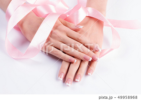 French manicure with pink ribbon. 49958968