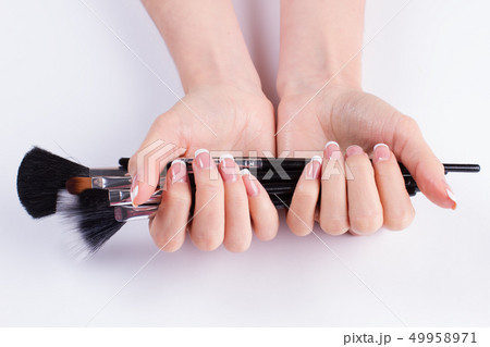 Beautiful french manicure with brush. Beautiful french manicure with brush. 49958971