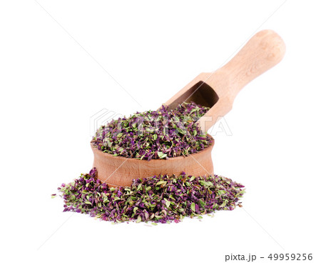Dried thyme flowers in wooden bowl, isolated on white background. Natural herbs - thyme. 49959256