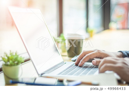 Asian young businessman working on his laptop. 49966433