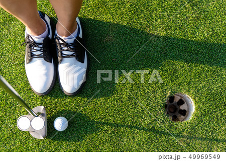 Top View golfer asian sporty woman focus putting  49969549