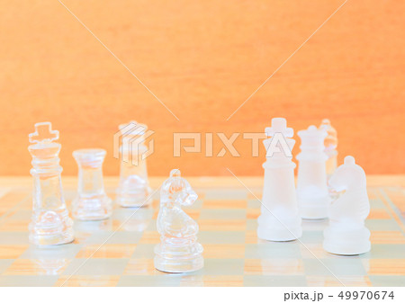 chess glass on board in game. On a vintage wooden 49970674