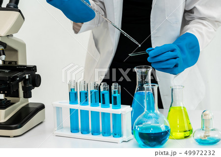 Woman scientist working in chemist laboratory. 49972232