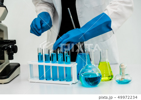 Woman scientist working in chemist laboratory. Woman scientist working in chemist laboratory. 49972234
