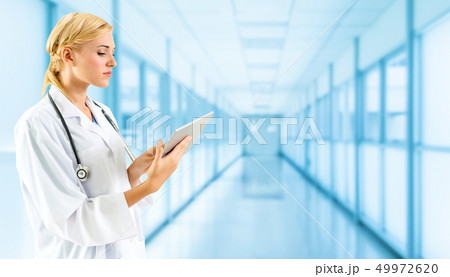 Doctor using tablet computer at the hospital. 49972620