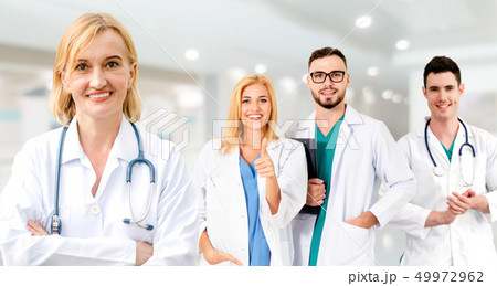 Doctor working in hospital with other doctors. Doctor working in hospital with other doctors. 49972962