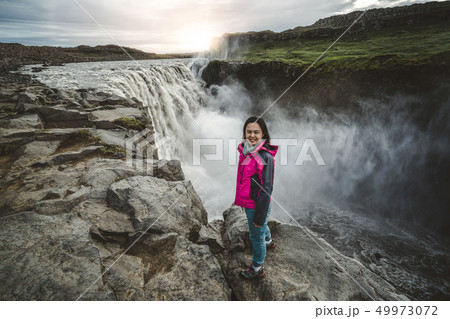 Traveler Travels to Dettifoss Waterfall in Iceland Traveler Travels to Dettifoss Waterfall in Iceland 49973072