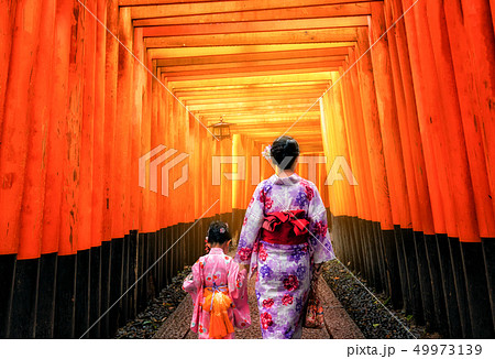 Traveler in Fushimi Inari Shrine, Kyoto, Japan Traveler in Fushimi Inari Shrine, Kyoto, Japan 49973139