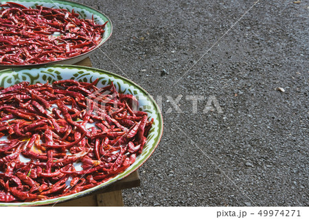drying red chili on tray. dried hot chilli pepper 49974271