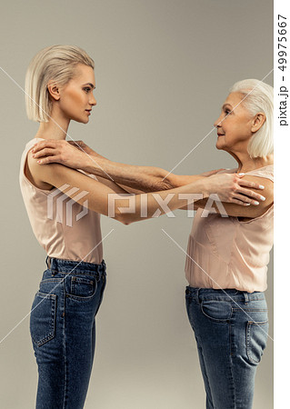 Nice pleasant women looking at each other 49975667