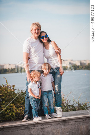 Happy family together against beautiful background 49977123