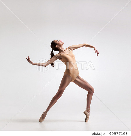 young beautiful dancer in beige swimsuit 49977163