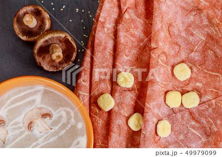 Composition with mushroom cream soup in pot Composition with mushroom cream soup in pot 49979099