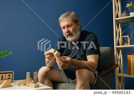 Old bearded man with alzheimer desease Old bearded man with alzheimer desease 49980183