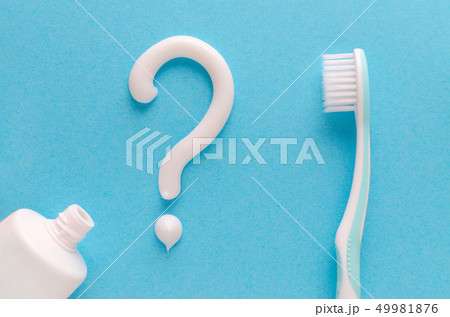 question from toothpaste, teeth care concept, toothbrush on blue background 49981876