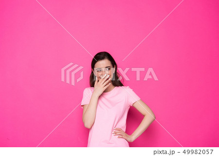 Cropped photo of happy brunette Caucasian girl posing for camera in studio 49982057