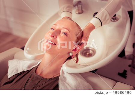 Close up of female hands that serving pretty client 49986496